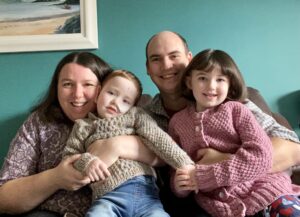 Fraser with his sister, mum and dad