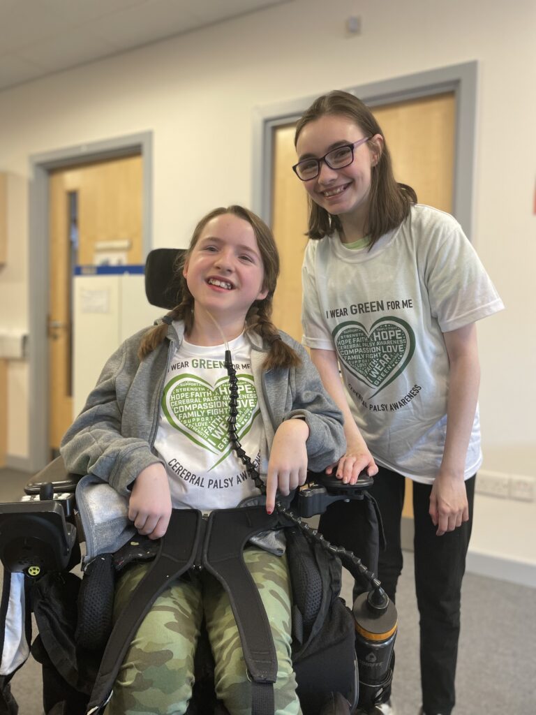 Debbie and her friend smiling at the camera