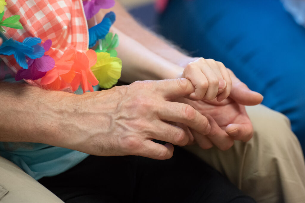 Child's hand holding adult's hand